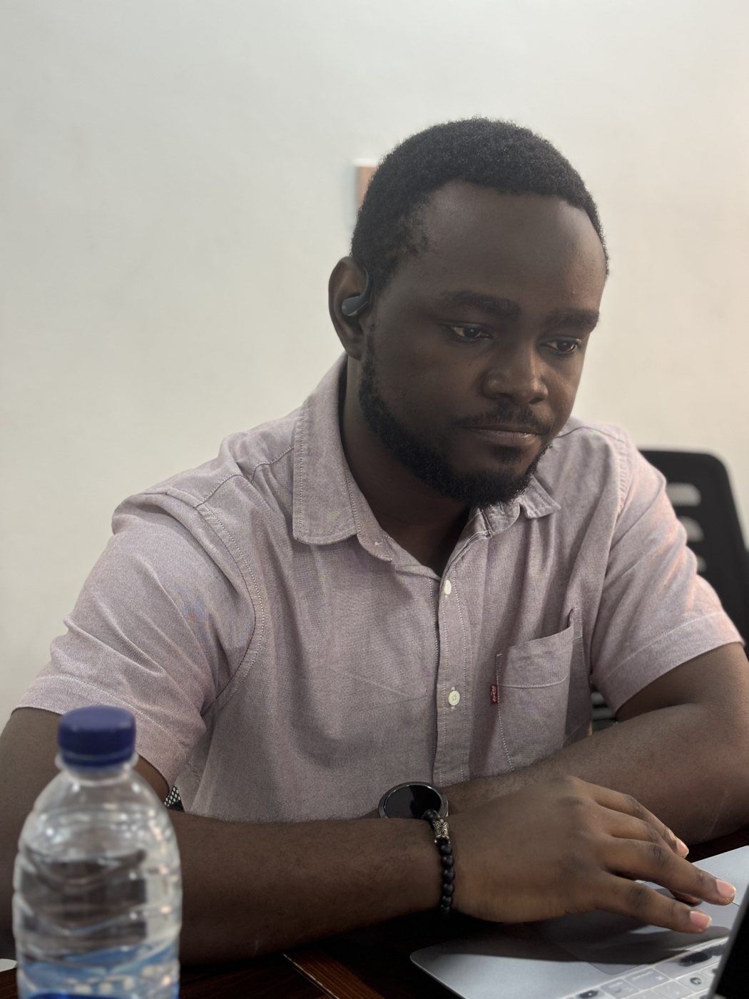Samuel Komolafe at his desk